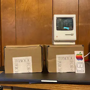 Jane shows the Mac-style clock on a tidy desk.